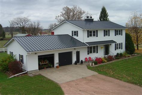 charcoal gray metal roof houses with green shutters|modern grey house interior.